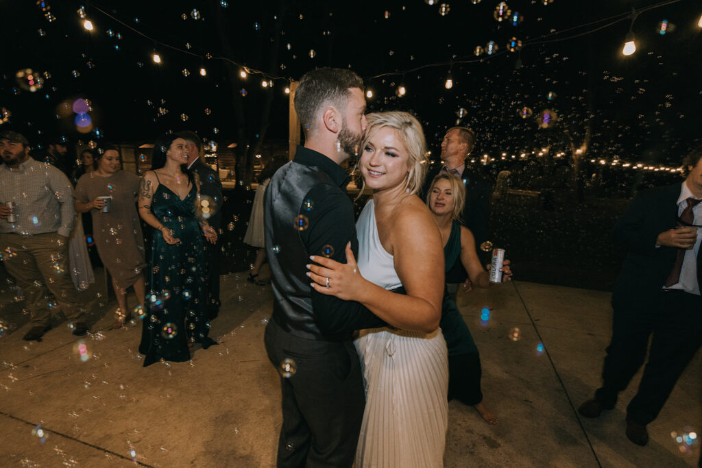 bride and groom having fun and dancing at the wedding reception