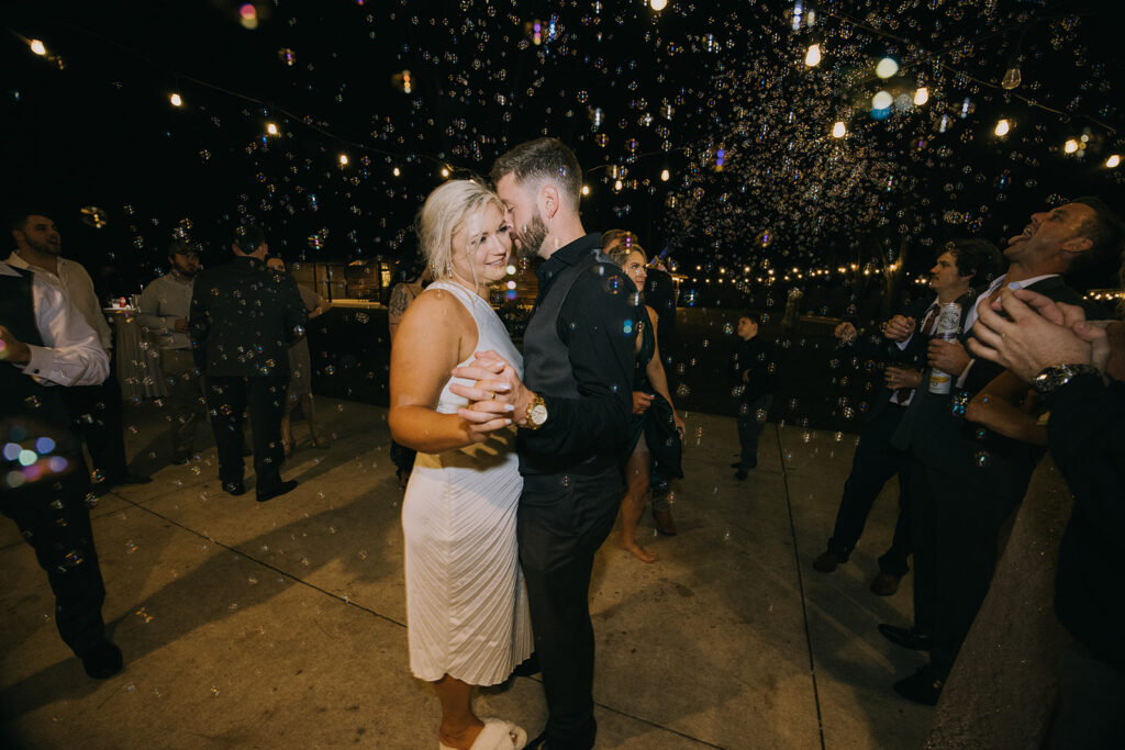 bride and groom having fun and dancing at the wedding reception