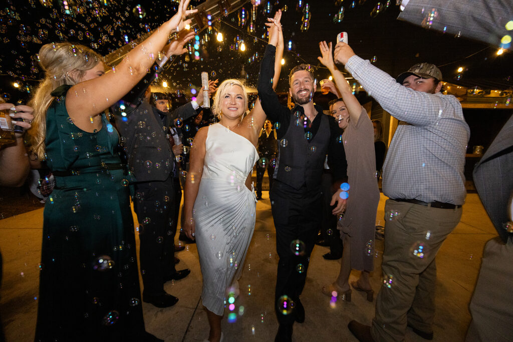 bride and groom having fun and dancing at the wedding reception