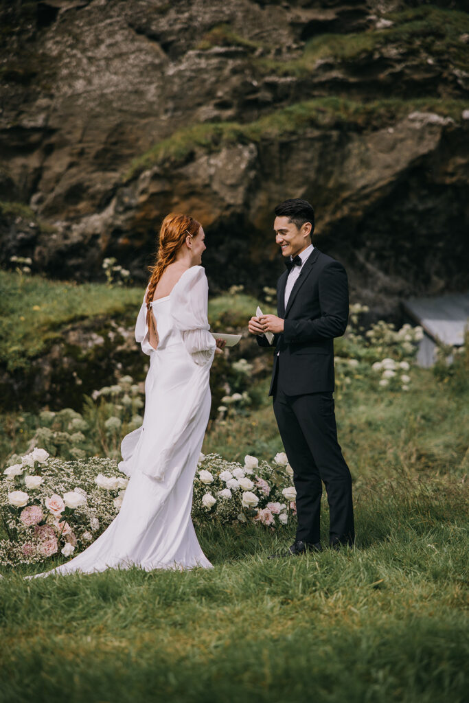 bride and groom exchanging vows surrounded by lush landscapes of Iceland