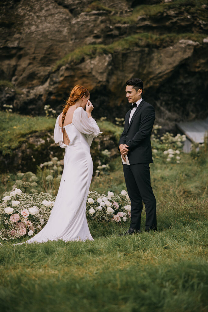 bride and groom exchanging vows surrounded by lush landscapes of Iceland