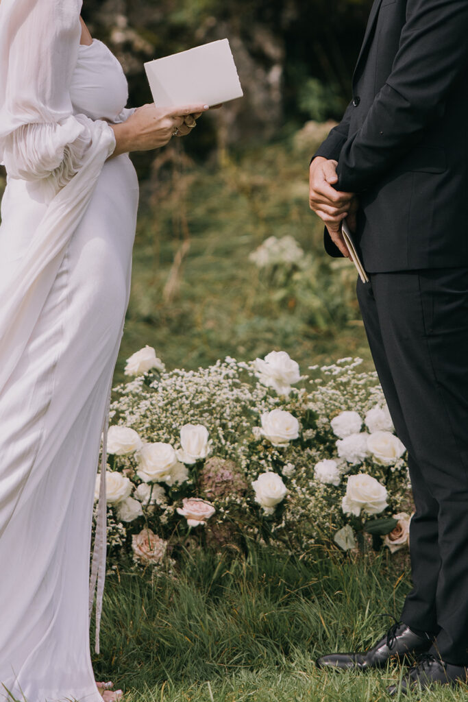 bride and groom exchanging vows surrounded by lush landscapes of Iceland