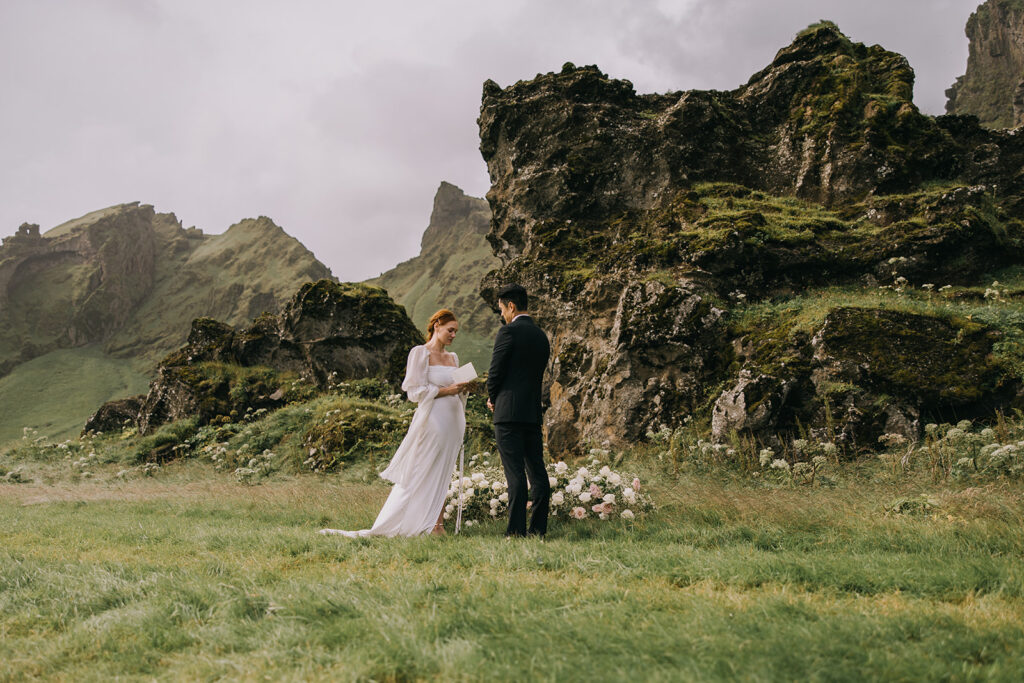 bride and groom exchanging vows at Skogafoss Waterfall