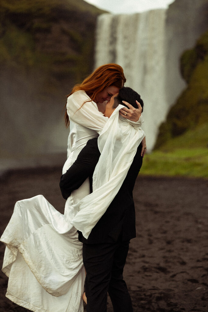 dreamy bride and groom during their Iceland Vow Renewal at Skogafoss Waterfall