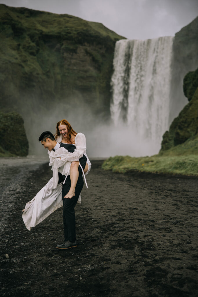 dreamy bride and groom during their Iceland Vow Renewal at Skogafoss Waterfall