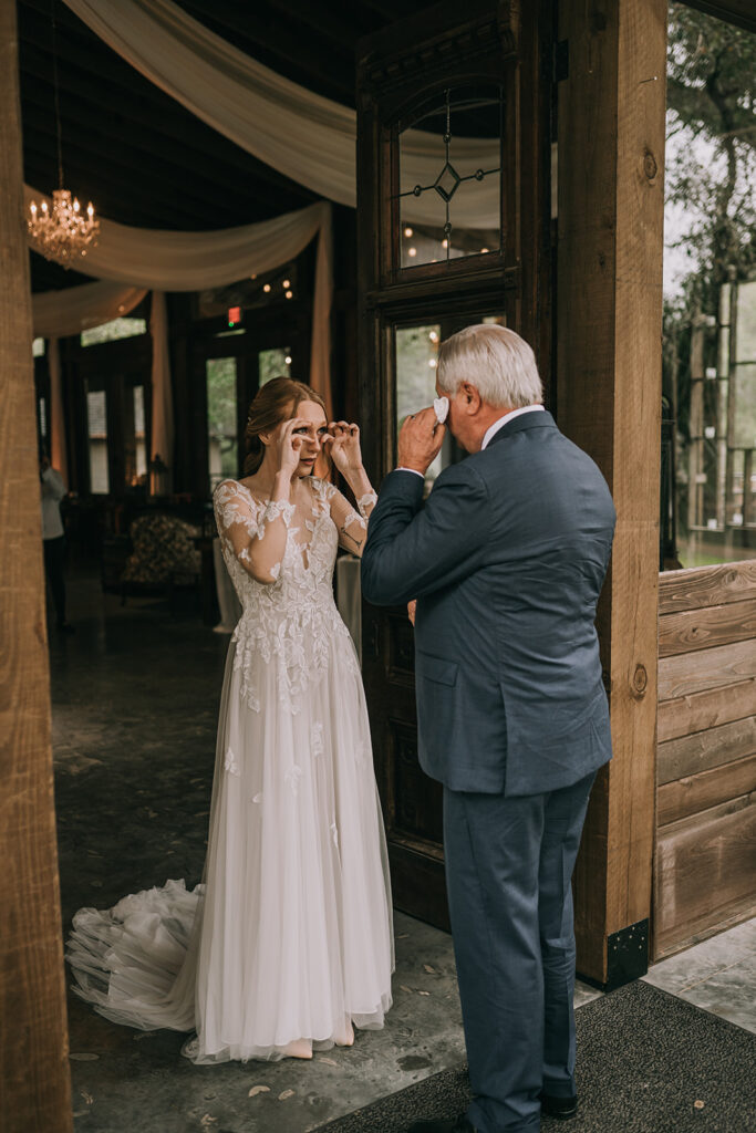 bride and dad first look as captured by the main photographer and second shooter