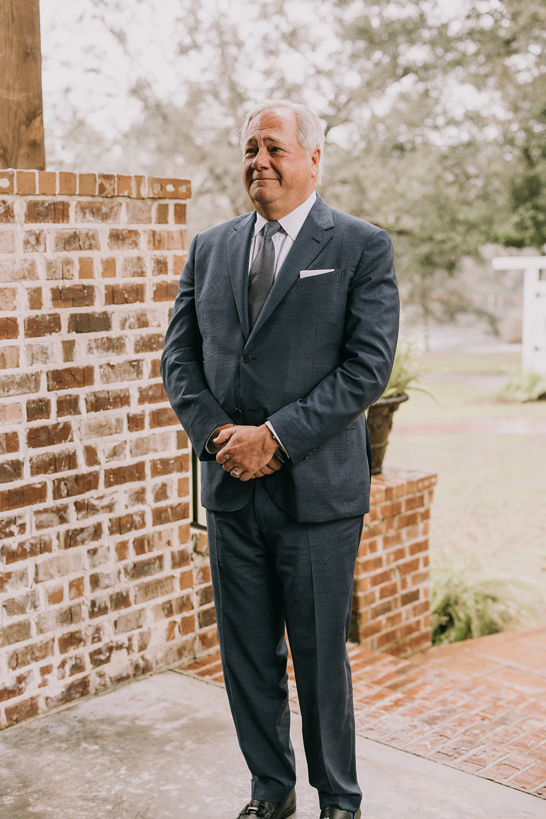 Father reacts to seeing his daughter in her white wedding dress before her wedding.